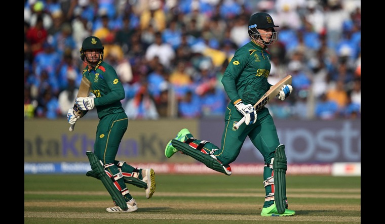 South Africa's Rassie van der Dussen (R) and Quinton de Kock run between the wickets | AFP